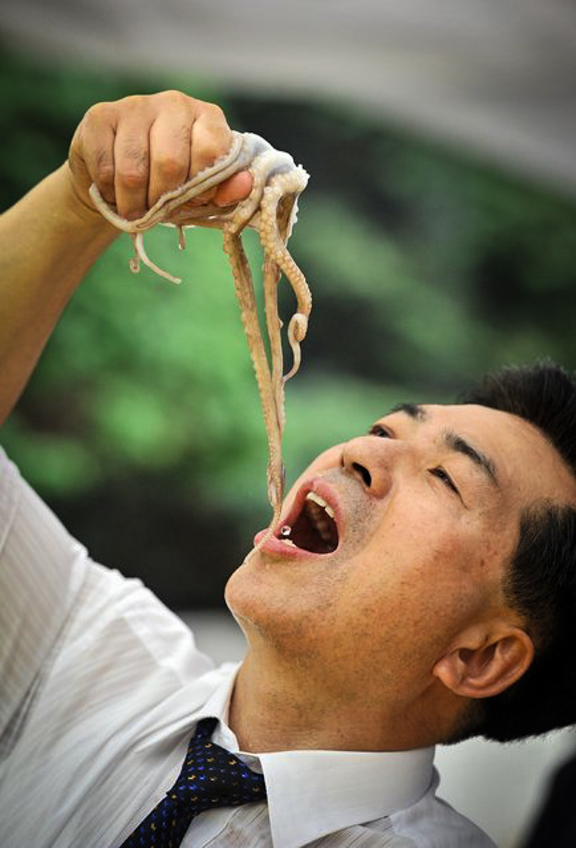 Girl Eats Live Fish